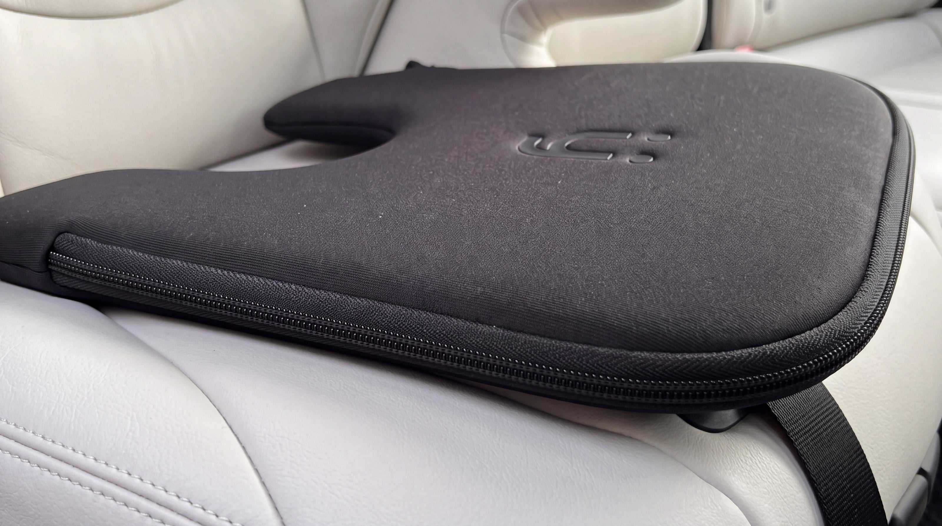 Close-up of the Babi Seat™ cushion on a leather seat