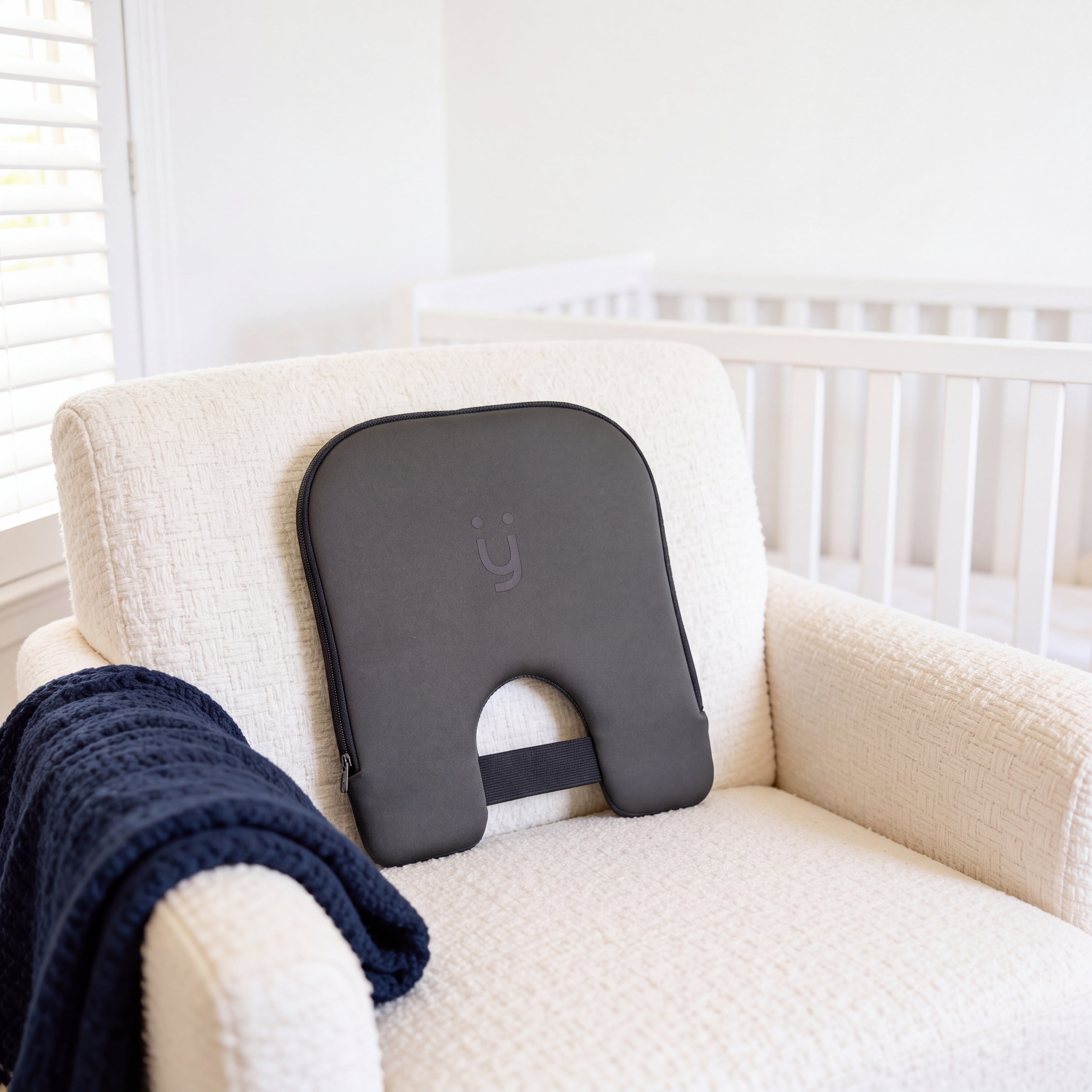 Babi Seat™ on a cream armchair
